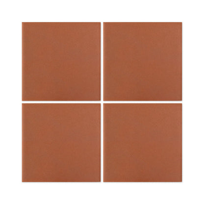 Four Mamey terracotta square clay tiles by Clay Imports, showing white grout and a subtle grainy texture.