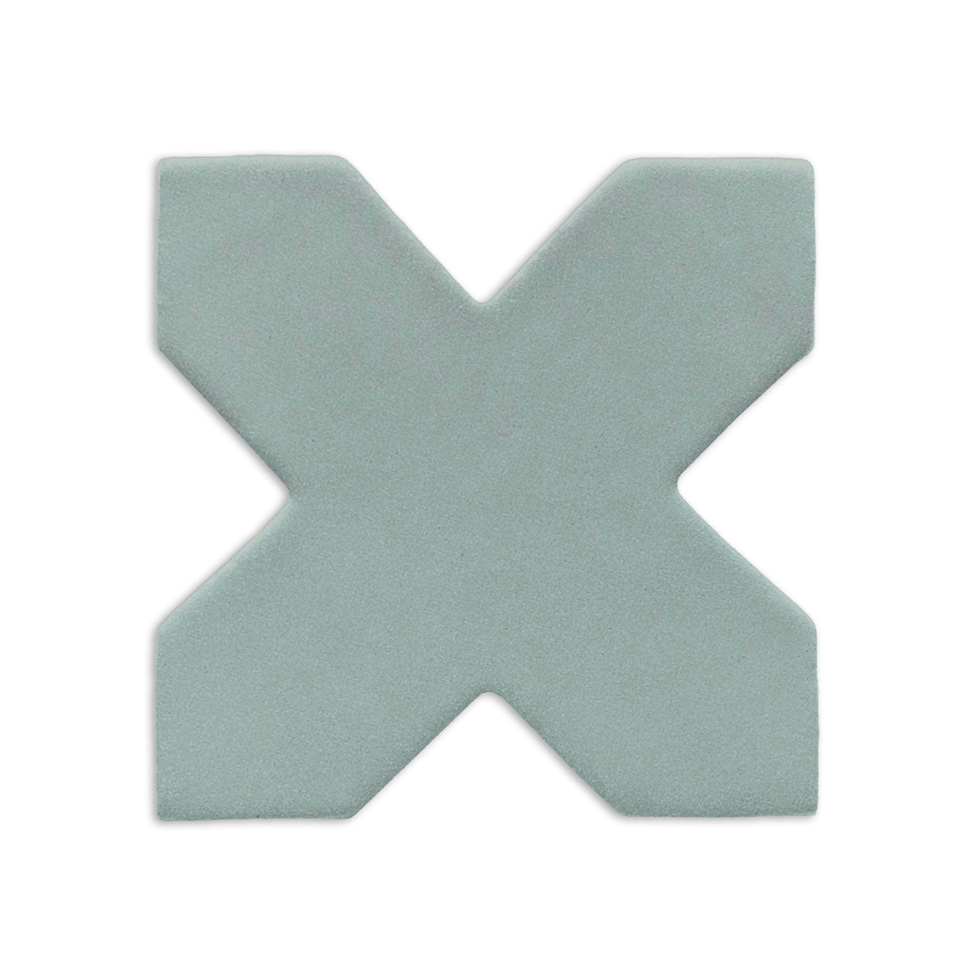 X-shaped clay tile in light sage green by Clay Imports, with a subtle matte texture.