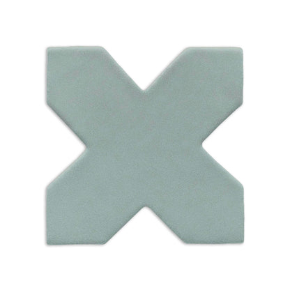 X-shaped clay tile in light sage green by Clay Imports, with a subtle matte texture.
