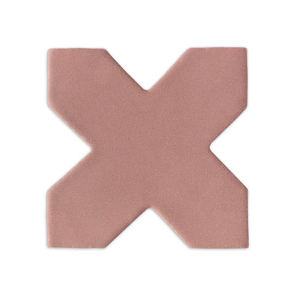 Mini cross-shaped clay tile in pink granite by Clay Imports, featuring a textured, matte surface with a subtle shadow.