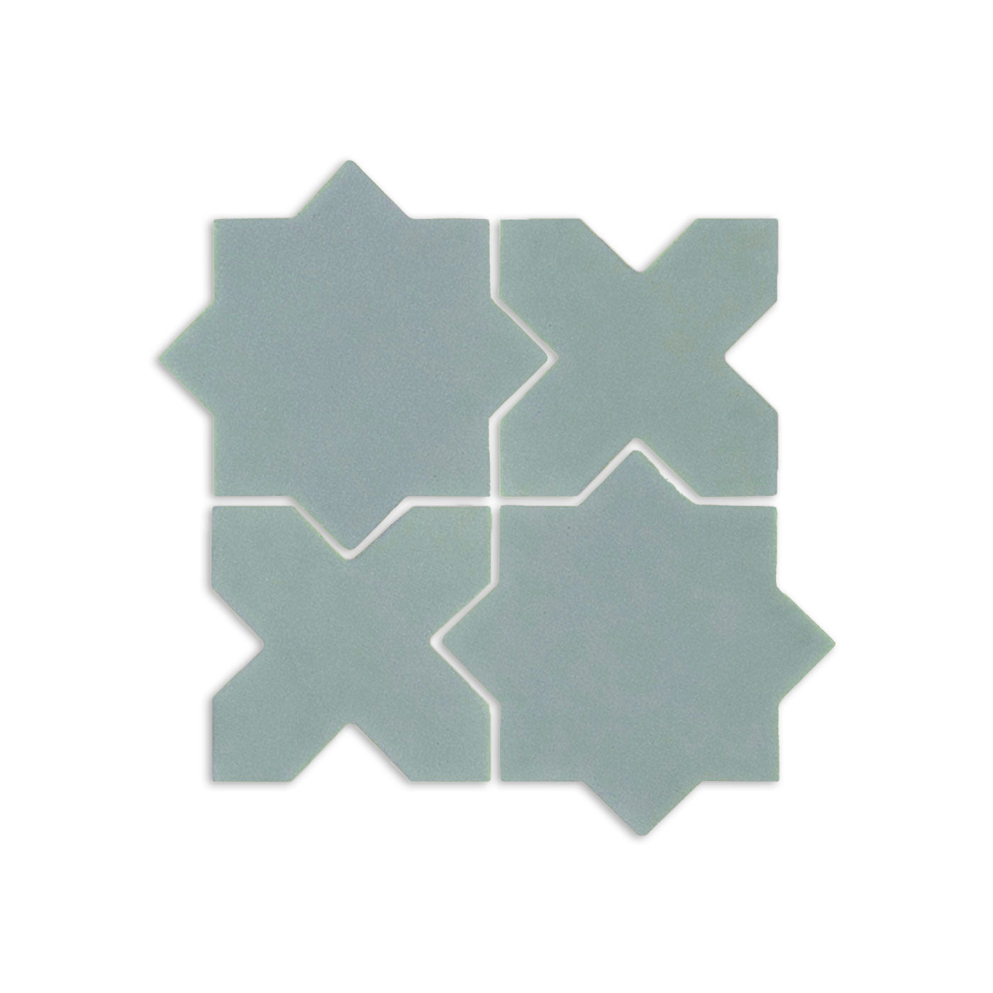 Sage mini star and cross clay tiles by Clay Imports forming a geometric pattern.