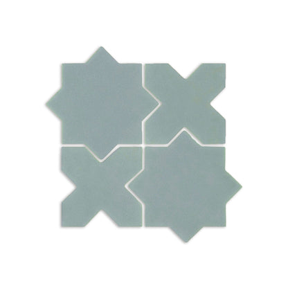 Sage mini star and cross clay tiles by Clay Imports forming a geometric pattern.