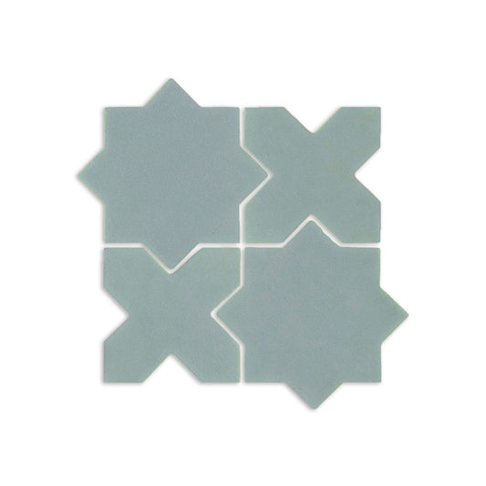 Sage mini star and cross clay tiles by Clay Imports forming a geometric pattern.
