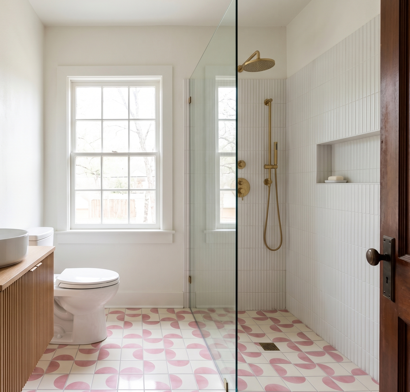 Mod Confetti 4.25x4.25 Solid Tile in a white and pink half-circle pattern by Clay Imports, covering a bathroom floor and shower.