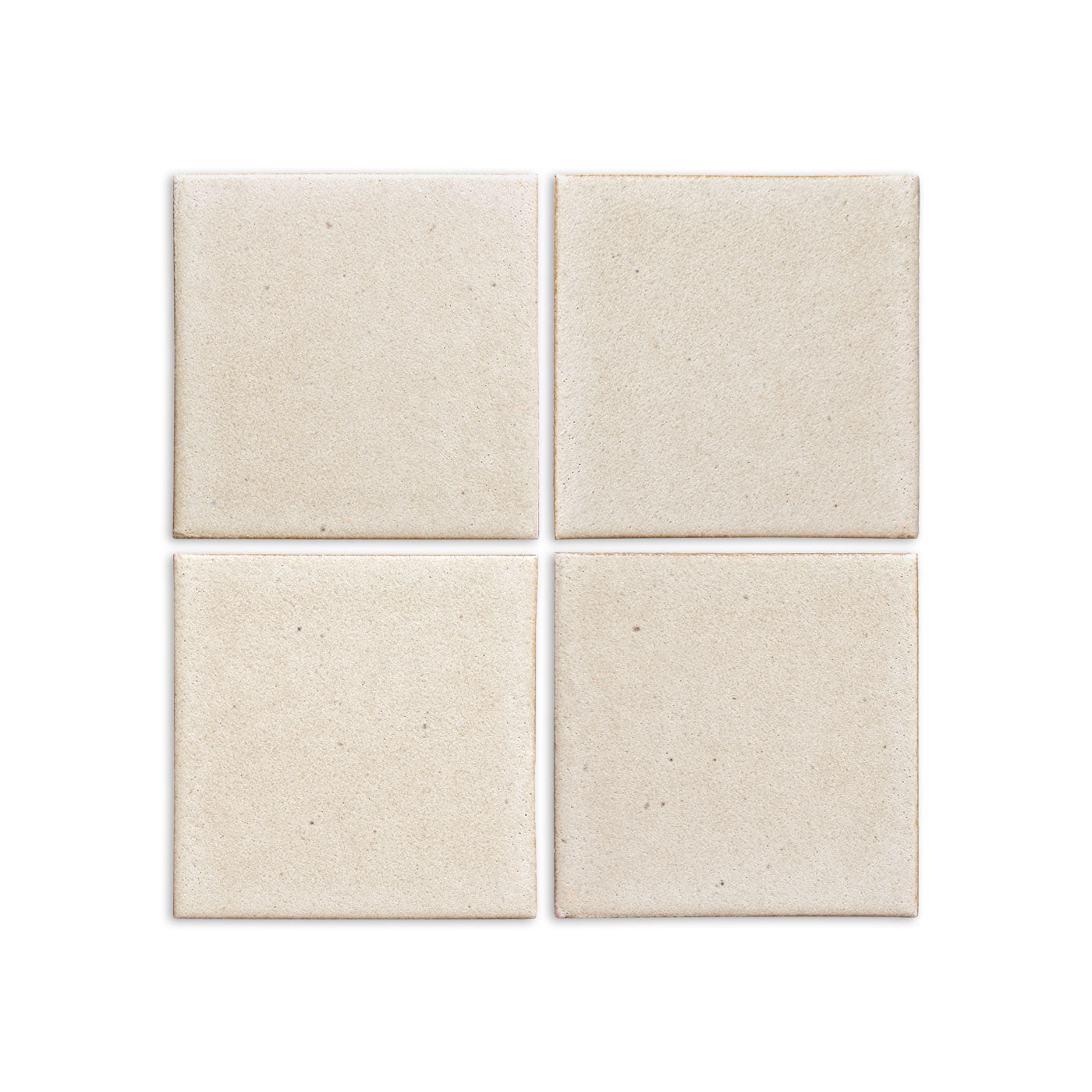 Four light cream Pearl Snap solid tiles by Clay Imports, featuring a matte, subtly speckled texture.
