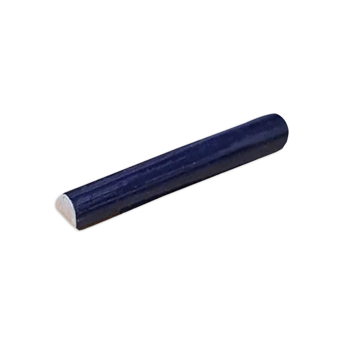 Dark blue half-round pencil liner tile by Clay Imports, viewed at an angle.