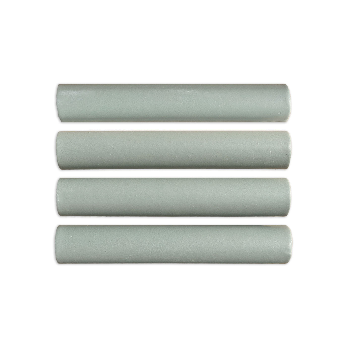 Four sage green pencil liner tiles by Clay Imports, arranged horizontally with slightly rounded ends and a matte, textured surface.