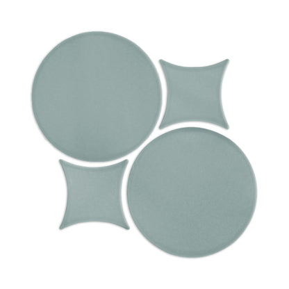 Muted green Rombo & Circle shape clay tile by Clay Imports, with an interlocking geometric pattern of circles and curved squares.