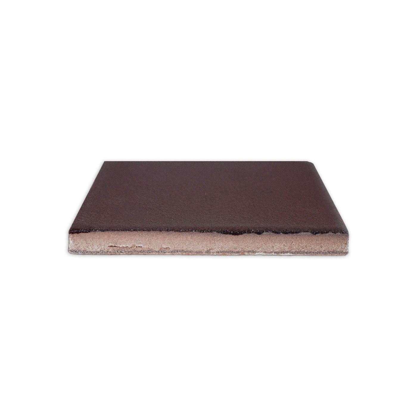 Dark brown 4.25x4.25 clay tile by Clay Imports, viewed from the side, revealing its textured top and exposed clay body.