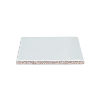 Spearmint 4.25x4.25 solid tile by Clay Imports, showing its smooth, glossy surface and textured brown underside.
