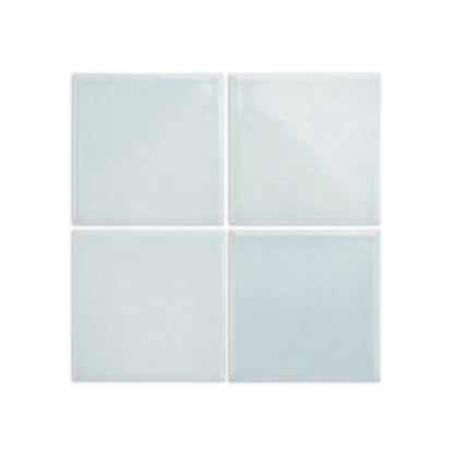 Spearmint solid tile by Clay Imports, featuring four glossy light blue-green squares with subtle texture.
