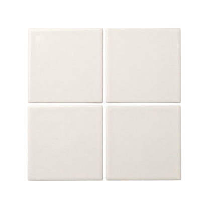 Four off-white square clay tiles by Clay Imports arranged in a grid with smooth, slightly rounded edges.