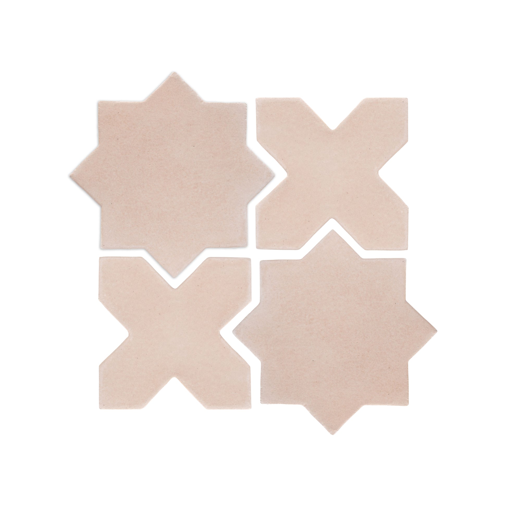 Four light beige ceramic star and cross tiles by Clay Imports, arranged in a grid with visible white grout lines.