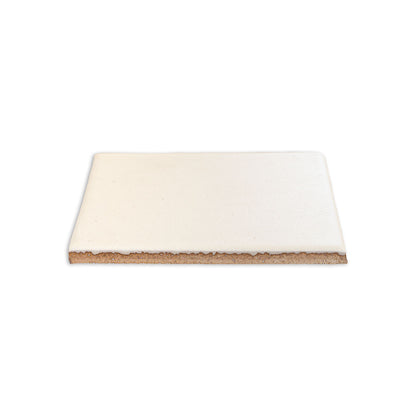 Mexican Vanilla 4.25x4.25 solid tile by Clay Imports, showing its glazed top and unglazed ceramic base.