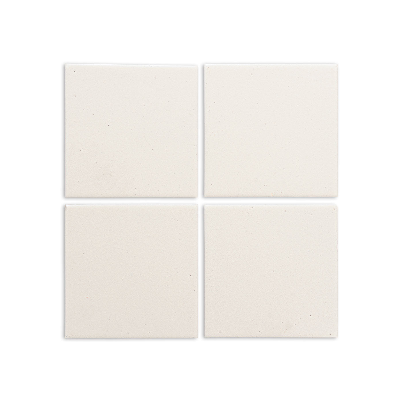 Mexican Vanilla 4.25x4.25 Solid Tile by Clay Imports, showing four cream-colored tiles with a subtle, speckled texture arranged in a grid.