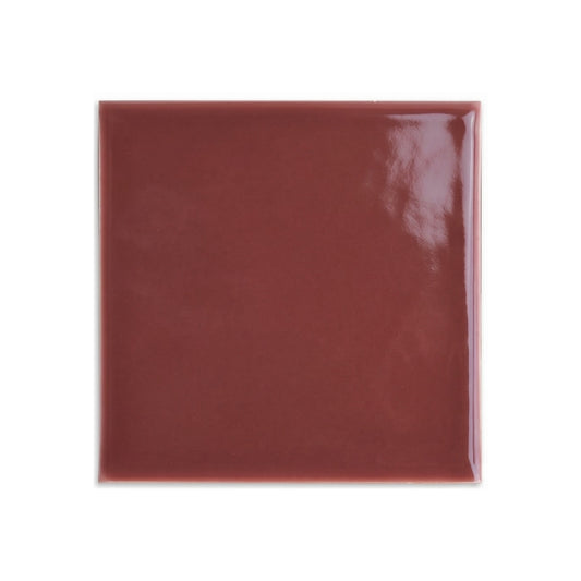 Burgundy gloss 4x4 tile sample by Clay Imports on a white background, featuring a reflective surface.