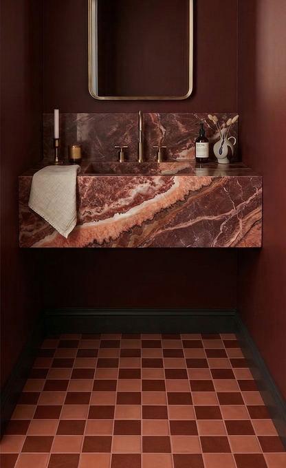 4.25x4.25 Barro solid tiles by Clay Imports forming a reddish-brown checkerboard pattern on a bathroom floor.