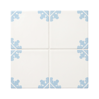 Four square ceramic tiles arranged in a 2x2 grid, featuring an off-white background with a light blue corner floral pattern.