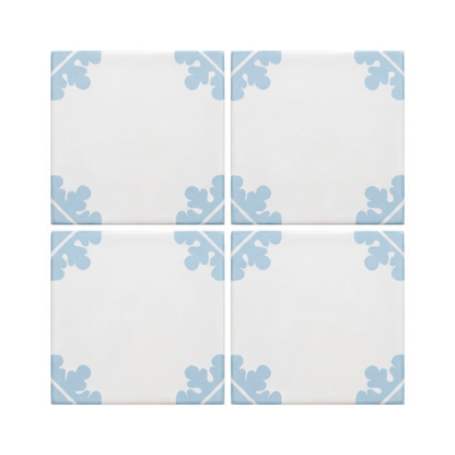 White Talavera tile with light blue corner floral motifs by Clay Imports, arranged in a 2x2 grid, glossy ceramic finish