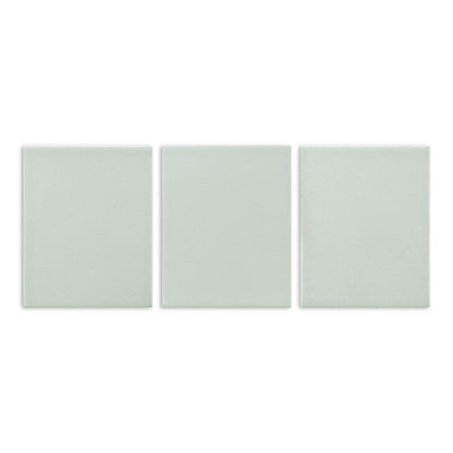 Three pale green matte solid tiles by Clay Imports, arranged side-by-side with a subtle grainy texture.