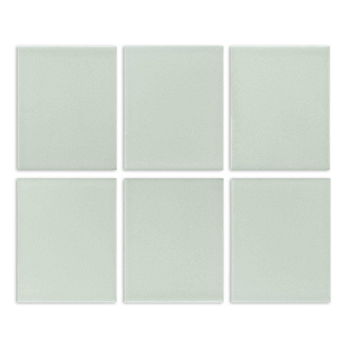 Six light sage green matte solid tiles by Clay Imports, arranged in a grid with a subtle speckled texture.