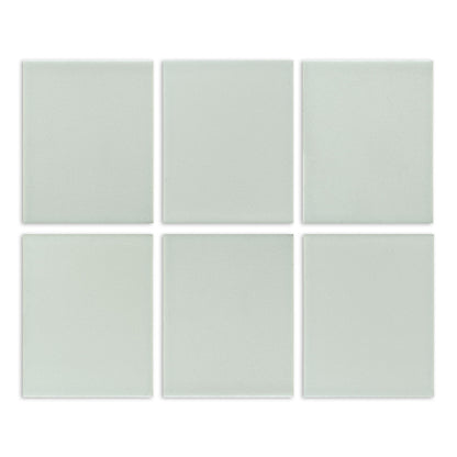 Six light sage green matte solid tiles by Clay Imports, arranged in a grid with a subtle speckled texture.