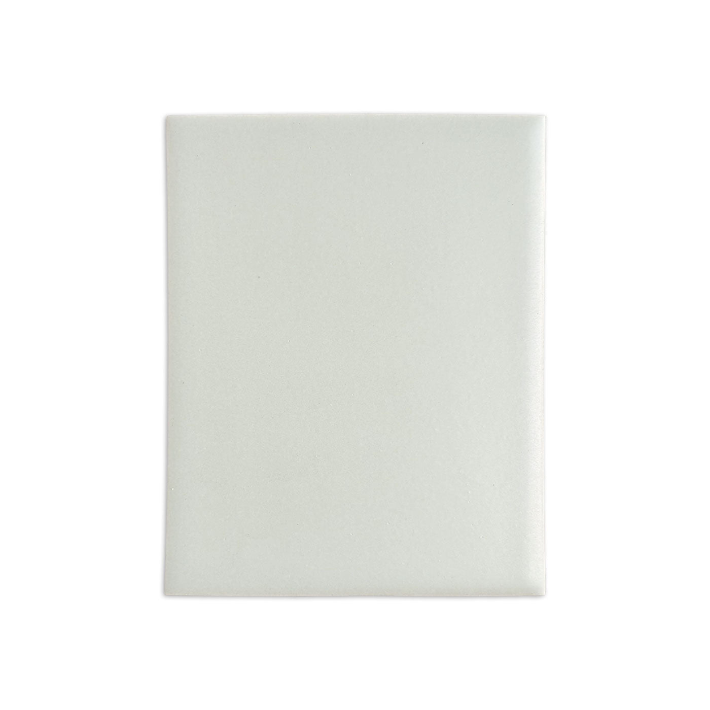 Matte off-white tile sample by Clay Imports, a rectangular tile with slightly rounded edges and subtle texture.