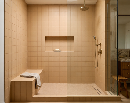 Sandbank Matte 4x5 solid tiles by Clay Imports, covering a modern sand-colored walk-in shower with a built-in bench.