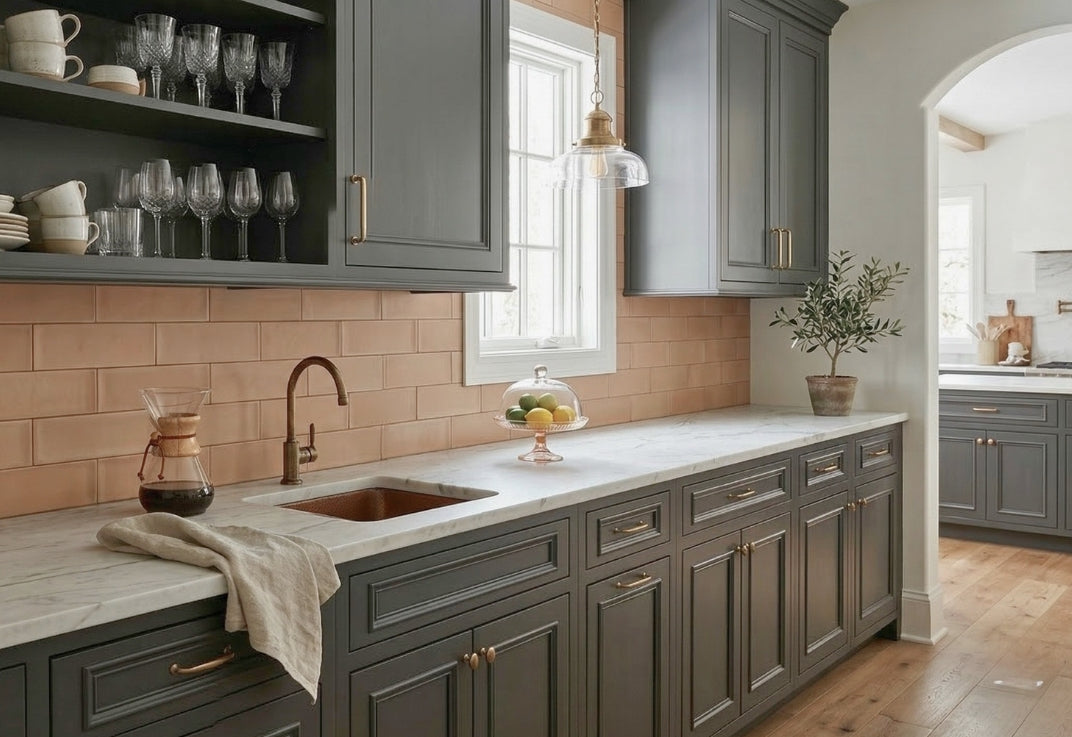 Bota Opaque 4x8 Artist Series subway tiles by Clay Imports, featuring a warm muted orange hue as a kitchen backsplash.