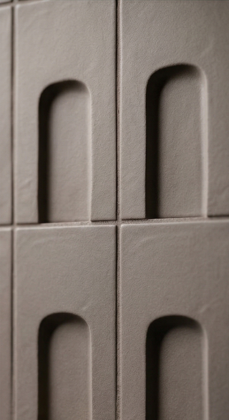 Brown clay tiles by Clay Imports featuring a repeated arched recess design, matte texture, and visible grout.