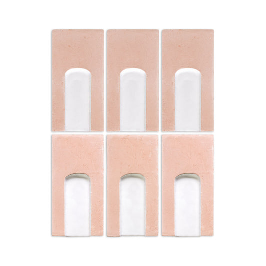Six rectangular terracotta and white ceramic tiles display an arched design arranged in a two-by-three grid.