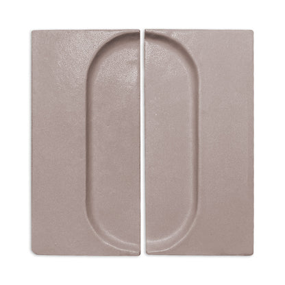 Brown clay tile by Clay Imports with a recessed oval design, shown as two rectangular pieces.
