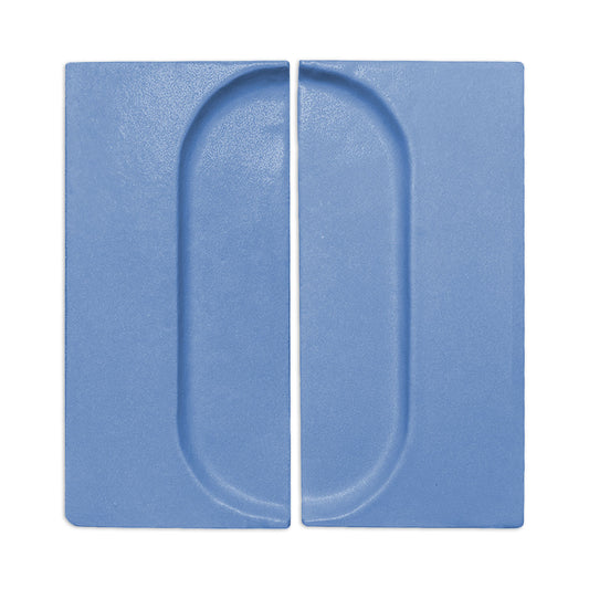 Denim blue oval shape clay tile by Clay Imports, featuring two rectangular tiles with recessed oval designs and a textured surface.