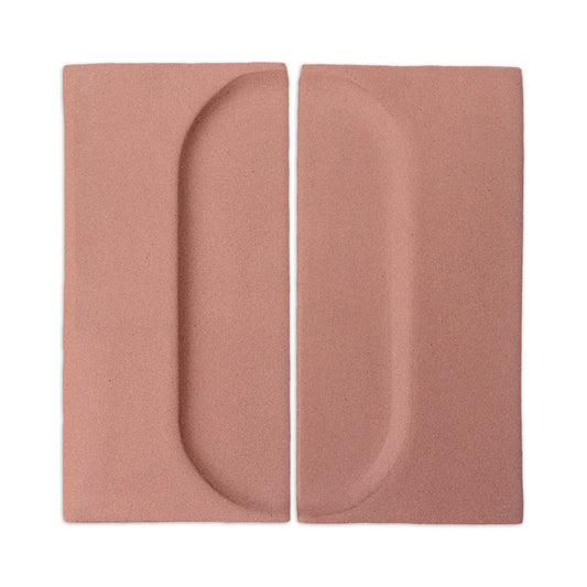 Two rectangular pink clay tiles with oval indents by Clay Imports, featuring a subtle granite-like texture.