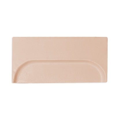 A rectangular sand-colored clay tile by Clay Imports featuring a recessed oval design and matte finish.