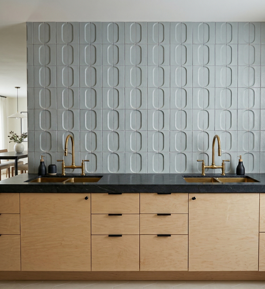 Gray Oval Spur clay tiles by Clay Imports, forming a modern kitchen backsplash above wood cabinets.