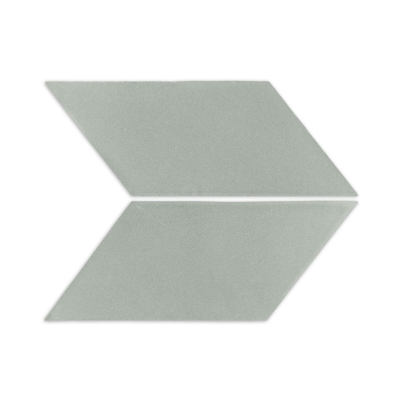 Agave parallelogram clay tiles from Clay Imports, two arranged as a light green arrow with a subtle speckled texture.