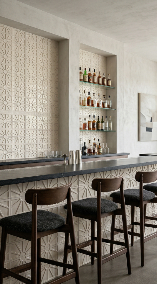 Petalito Candela light beige clay tiles by Clay Imports, with a raised geometric sunburst pattern on a modern bar wall and counter.