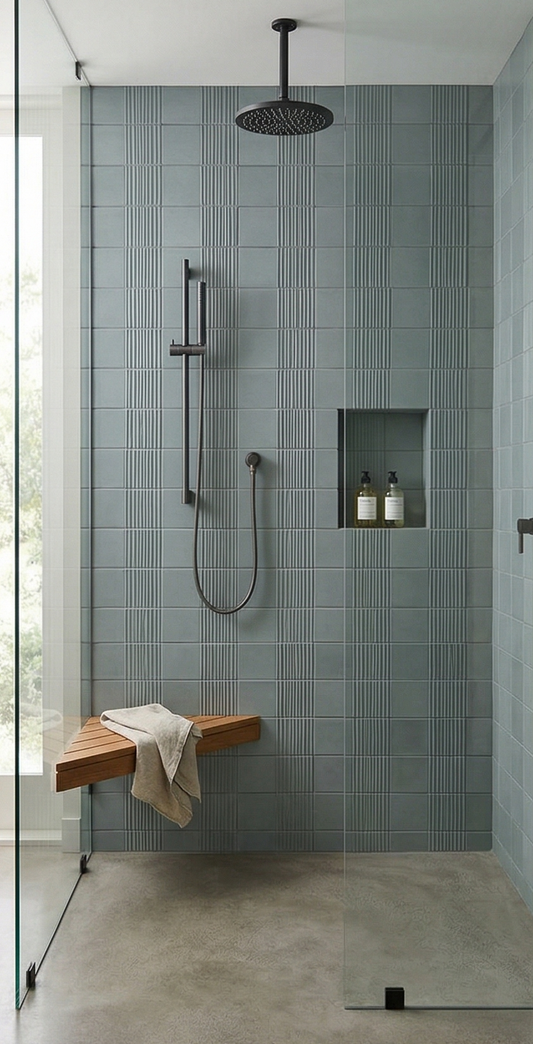 Green ceramic shower tiles by Clay Imports, featuring alternating smooth and ridged vertical patterns.