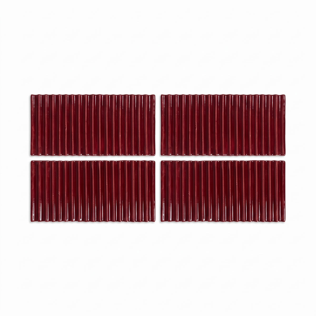 Four rectangular dark red ribbed tiles arranged in a 2x2 grid on a plain white background.