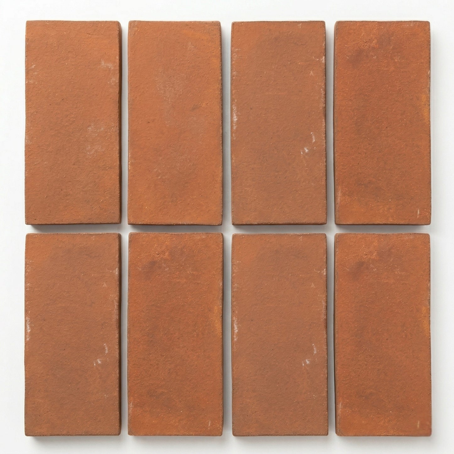 Umber Cotto tiles by Clay Imports, displaying a rustic texture in a rectangular arrangement.