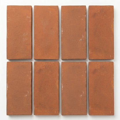 Umber Cotto tiles by Clay Imports, displaying a rustic texture in a rectangular arrangement.