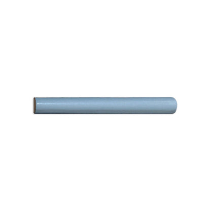 Light blue-gray Pencil Liner Tile by Clay Imports with a half-round profile, one end flat, the other rounded.