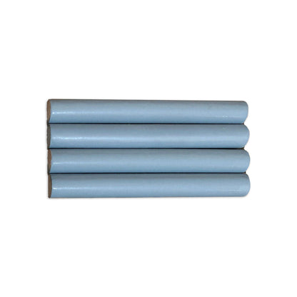 Light blue pencil liner tile by Clay Imports, with four pieces stacked horizontally showing natural exposed edges.