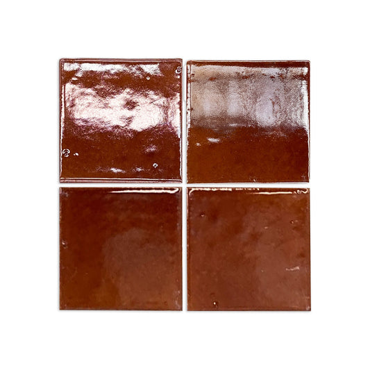 Four glossy Root Beer square clay tiles by Clay Imports, displaying subtle surface variations.