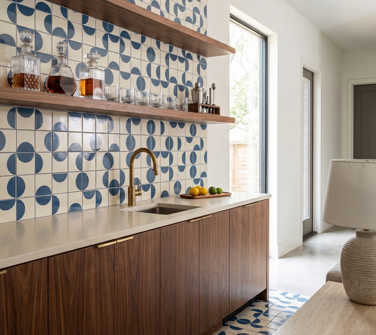 Solid tile with blue and white geometric pattern by Clay Imports, forming a backsplash in a modern wet bar.