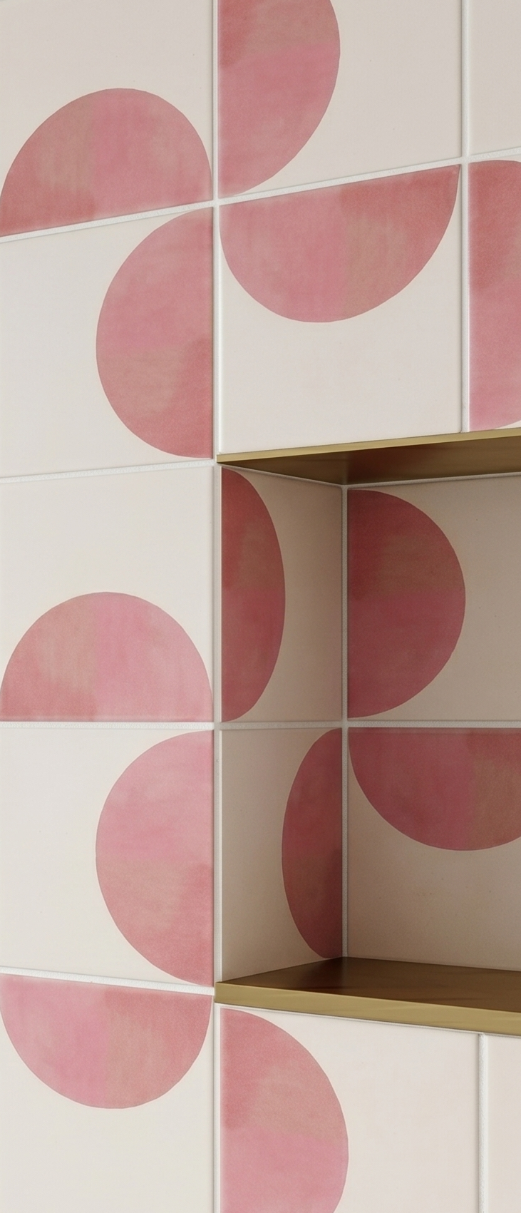 Pink and cream solid tile by Clay Imports with a Mod Confetti semi-circular pattern, featuring integrated gold shelving.