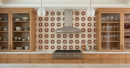 Traditional Talavera tile with an oxblood floral pattern by Clay Imports Handmade Tile, installed as a kitchen backsplash.
