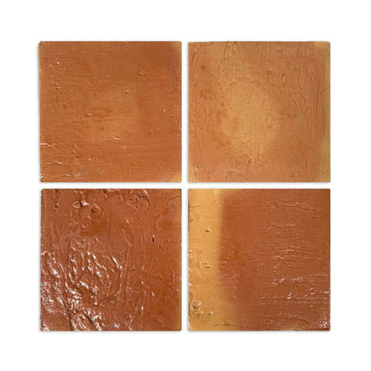 Four glossy terracotta tiles by Clay Imports with rustic reddish-brown texture and varying hues, arranged in a grid.