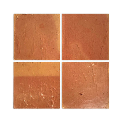 Four 4x4-inch antique satin terracotta tiles by Clay Imports, showing a rustic, textured surface and natural color variations.